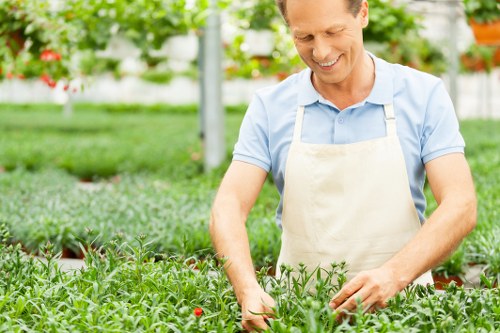 Seasonal planting and soil care by gardeners in Sudbury